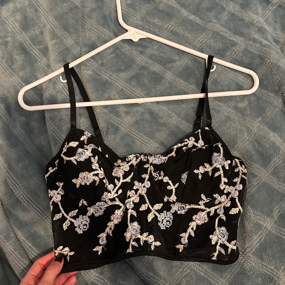 Black crop top with white and pink floral embroidery